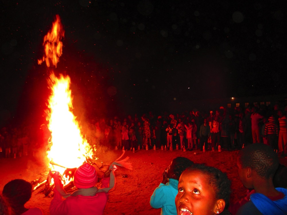 Children around the St John Festival bonfire